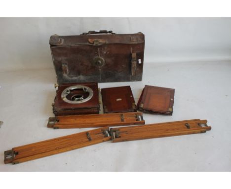 A 19TH CENTURY MAHOGANY PLATE CAMERA A/F IN LEATHER CASE WITH A TRIPOD