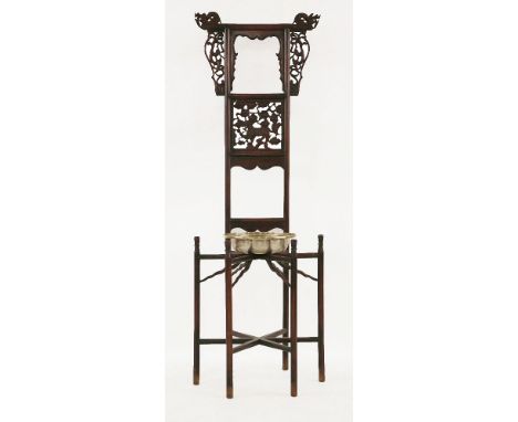 A late 19th century hardwood washbasin stand, the top rail with dragon terminals above dragon spandrels, the centre panel wit
