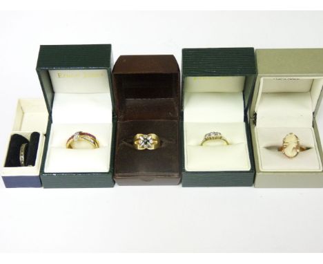 A 9ct gold ruby and diamond channel set ring, a three stone diamond ring marked 18ct plat, a 9ct gold sapphire and diamond ri