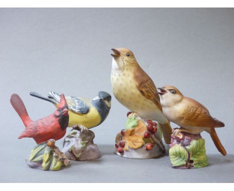 Four Royal Worcester bone china birds, Red Cardinal, Great Tit, Nightingale, Thrush