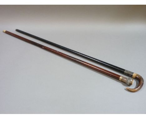 A gentleman’s walking cane, with 9ct gold collar and horn grip and ferrule, 90.3cm and an ebonised walking cane with silver p