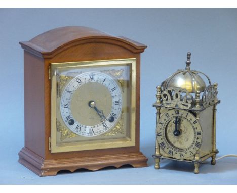 A modern mantel clock, and a modern brass lantern style clock