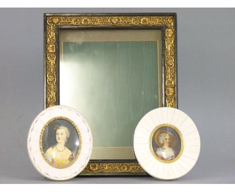 A pair of early 20th century portrait miniatures in piano ivory mounts, and a Victorian photograph frame with moulded gilt sh