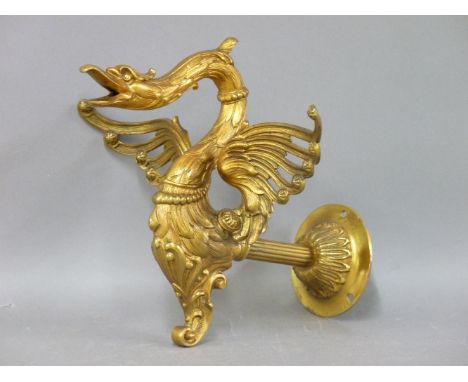 A 19th century gilt metal wall mounted light fitting, cast as a stylised swan with outspread wings, the same design can be se