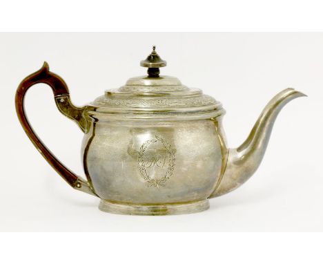 A George III silver teapot, by Soloman Hougham, London 1803, of bellied oval form, with bands of floral decoration to cover a