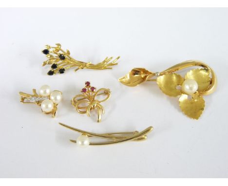 A gold cultured pearl flower brooch, marked 750, a 9ct gold sapphire spray brooch, a 9ct gold ruby bow brooch, a 9ct gold cul