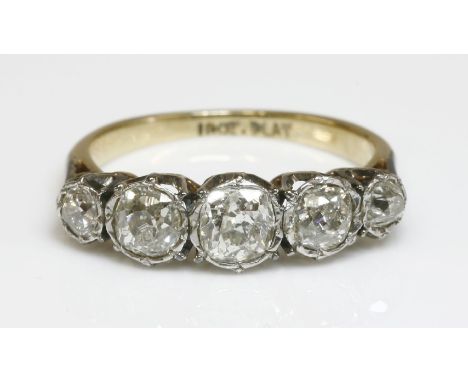 A graduated five stone diamond ring, with cushion cut and old European cut diamonds, all grain set to illusion plates, white 