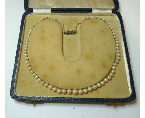 A single row graduated cultured pearl necklace, on a sterling silver clasp