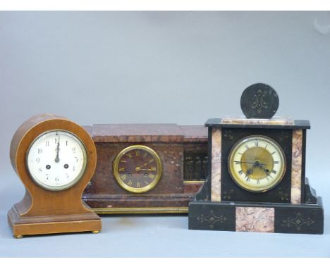 A red marble mantel clock, a walnut balloon mantel clock, and a black slate mantel clock