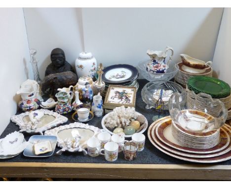 A collection of ceramic ornamental wares, including a pair of cherub and fan frames, four reproduction tiles, German cabinet 