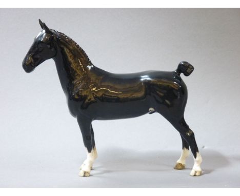 A Beswick Hackney horse, 'Champion Black Magic', and a Highland pony