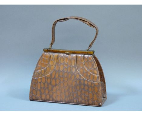 A 1940s brown leather mock crocodile skin handbag, with Bakelite clasp, together with a letter atrributing it to the Express 