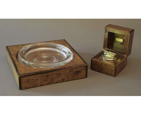 A Gucci table lighter and ashtray, both in burr walnut mounts