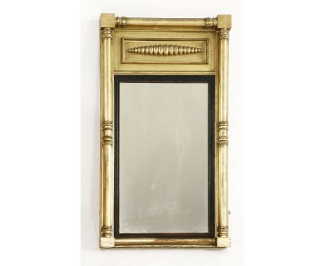 A 19th century gilt framed mirror, with reeded ebony slip and plain columns with leaf capitals, 110cm long, 58.5cm wide