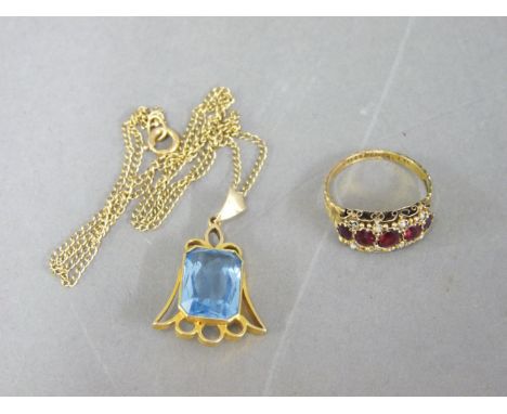 A blue paste pendant, marked 9ct, and a 9ct gold Victorian red paste ring