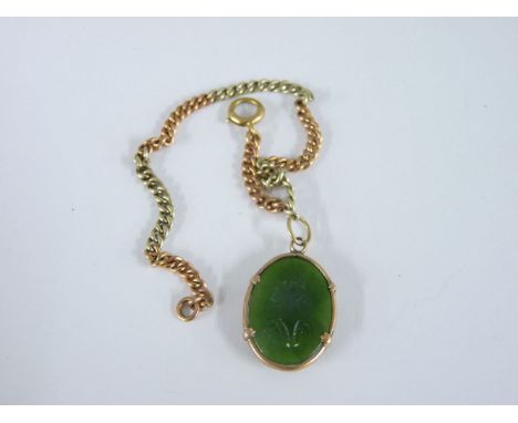 A 9ct two colour gold bracelet, with jade intaglio charm