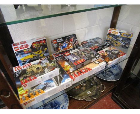Shelf of 9 new boxed Star Wars Lego sets