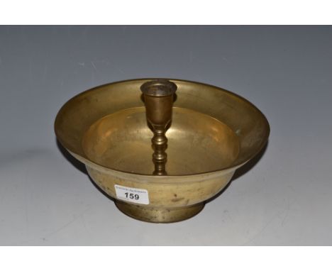 A 19th century Middle Eastern brass candlestick