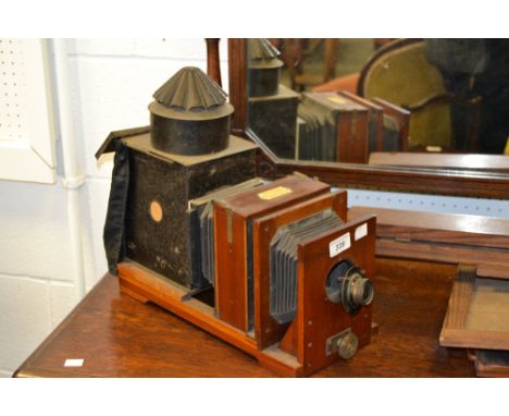 A Lancasters Condenser Magic Lantern, by Lancaster & Son, Birmingham;  stand and plates
