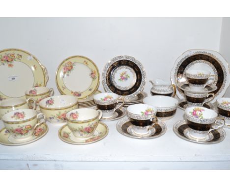 A Staffordshire china part tea service decorated with gilt and black borders; a Johnson Bros 'Pareek' pattern part tea servic