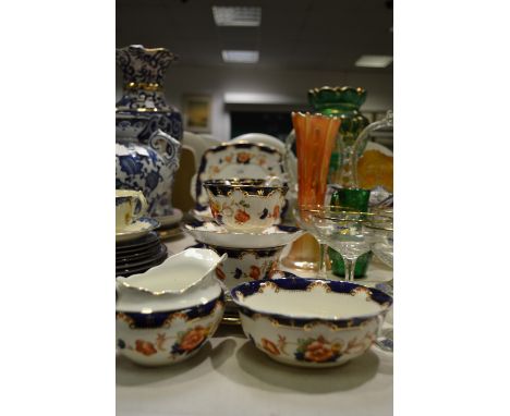 A Royal Albert six-setting tea service, decorated in the Imari pallet, comprising bread plate, milk and sugar, cups, saucers 