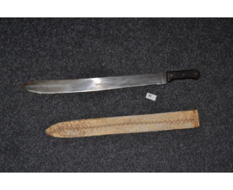 A machete, leather covered sacabbard