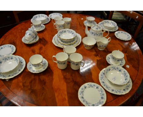 A Colclough part tea service , decorated with blue floral sprigs 