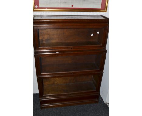 An early 20th century three section Globe Wernicke bookcase, plinth base, c.1930