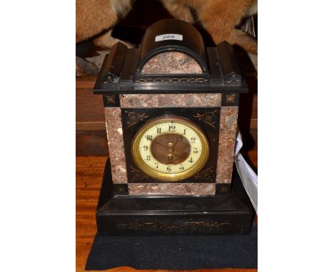 A Victorian black slate mantel clock, French movement, Arabic numerals on a cream enamel dial, inlaid with marble, graduating