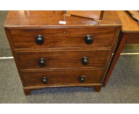 A Victorian mahogany chest of drawers, three long graduated drawers, turned handles, bracket feet