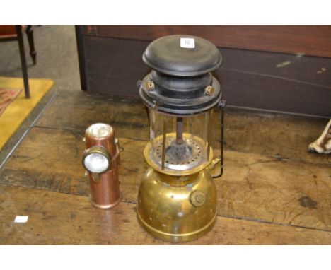 A mid twentieth century miners lamp , arrow mark ; an early twentieth century lamp (2)