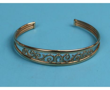Gold blue topaz set bangle
