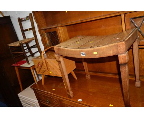 AN EDWARDIAN WALNUT PIANO STOOL, a teak sewing box, two beech stick back chairs, a formica topped occasional table and a rush