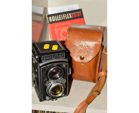 A ROLLEIFLEX 3.5 B TWIN LENS REFLEX CAMERA, in leather case and fitted with a Heidoscop 2.8 Anastigmat lens and a Carl Zeiss 