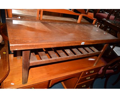 A TEAK COFFEE TABLE with a slatted under shelf