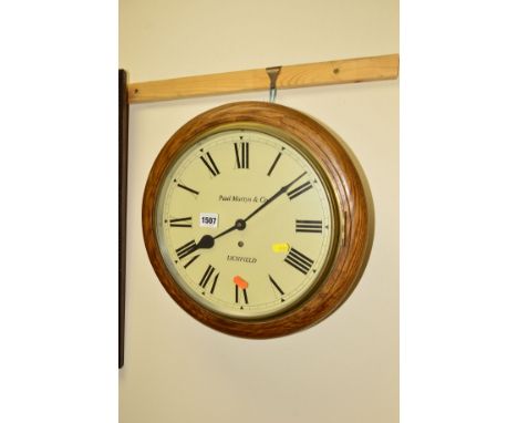 A MODERN CIRCULAR WALL CLOCK, marked Paul Martyn and Co, Lichfield