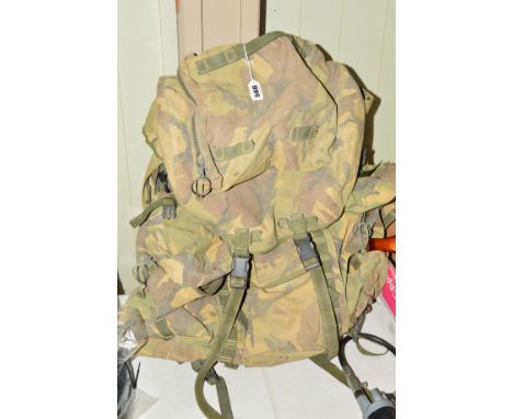 A CURRENT BRITISH ARMY ISSUE 'BERGEN' BACK PACK, in regulation camo, all complete and marked in ink to a soldier with Grenadi