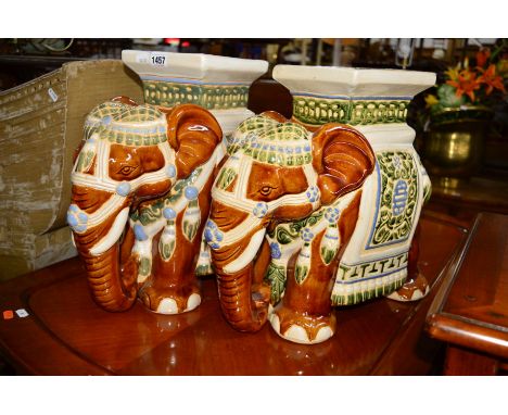 A PAIR OF GLAZED CERAMIC ELEPHANT STOOLS