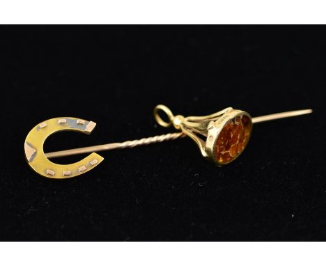 AN EDWARDIAN 15CT GOLD STICKPIN AND A GOLD FOB CHARM, the Edwardian stick pin with a horse shoe terminal, 15ct hallmark for C