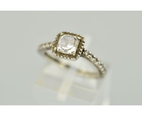 A PANDORA RING designed with a square shape colourless cubic zirconia within a cubic zirconia surround with further circular 