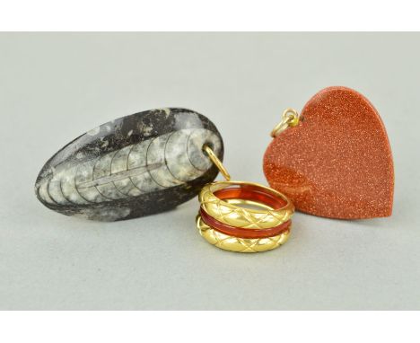 TWO PENDANTS AND A RING to include a goldstone heart, a fossil pendant and a dress ring which has an interchangeable cornelia