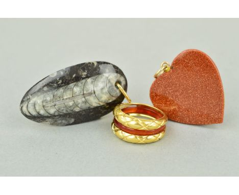 TWO PENDANTS AND A RING to include a goldstone heart, a fossil pendant and a dress ring which has an interchangeable cornelia