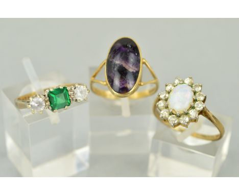 THREE GEMSTONE SET RINGS to include a 9ct gold Blue John oval cabochon, rub over set, ring size N, hallmarked 9ct gold, Sheff