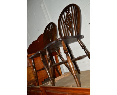 FOUR VARIOUS OAK WHEEL BACK CHAIRS including two carvers, together with a pair of early 20th Century circular seated stick ba