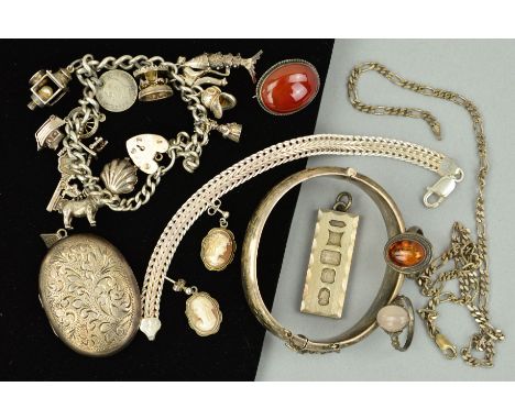 A SELECTION OF ASSORTED SILVER JEWELLERY ITEMS to include an oval fully engraved locket, a cornelian brooch, an oval half eng