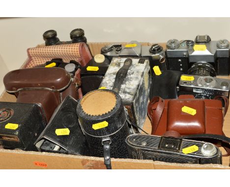A TRAY OF CAMERAS AND BINOCULARS, including a Rollei B35, Taron, Praktica, Zenith, etc