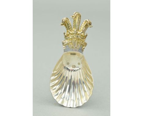 A SILVER CADDY SPOON with shell designed bowl and the Prince of Wales feathers to the handle, with silver hallmark for 1981, 