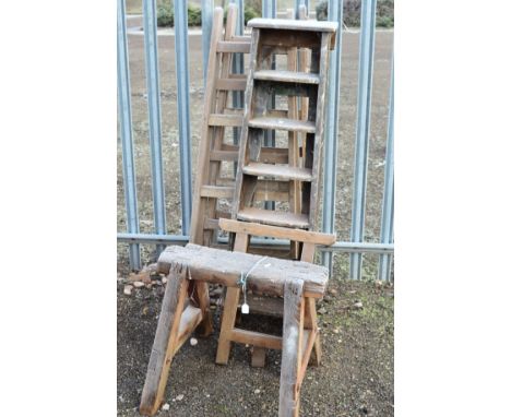 A PAIR OF WOODEN TRESSLE STANDS, another single smaller one, step ladders and work horse (5)