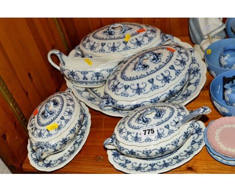 A PART BLUE AND WHITE DINNER SERVICE to include two tureens, two sauce tureens and stands (one with ladle), meat platter and 
