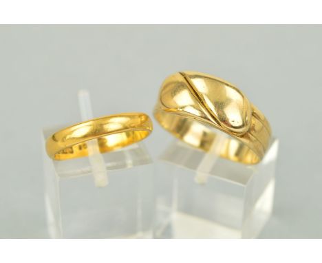 TWO RINGS, the first designed as overlapping snakes (detail rubbed), stamped 9ct, ring size V1/2, weight 6.5 grams, the secon